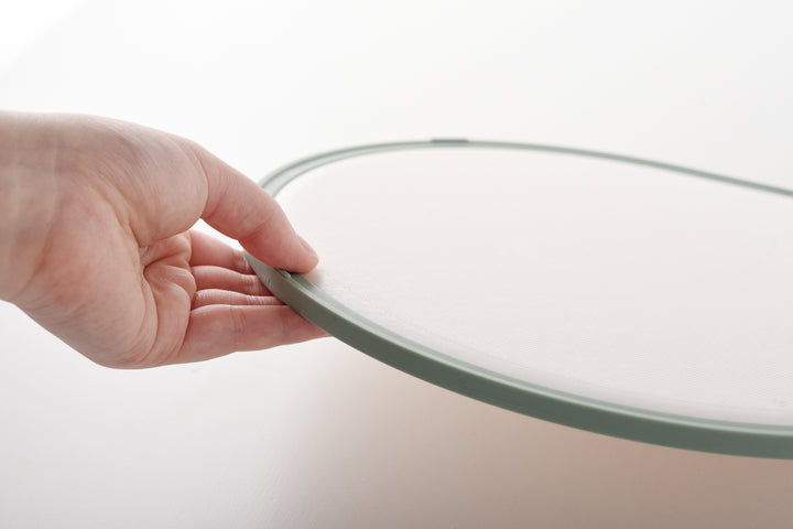 Teardrop-shaped cutting board